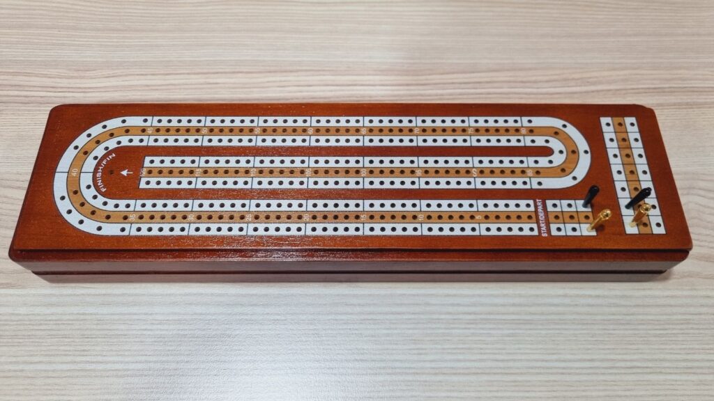 cribbage board with pegs