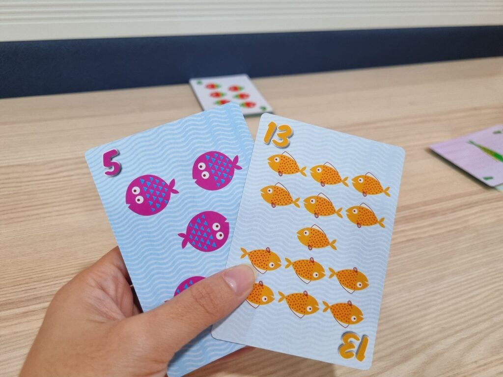 holding go fish cards