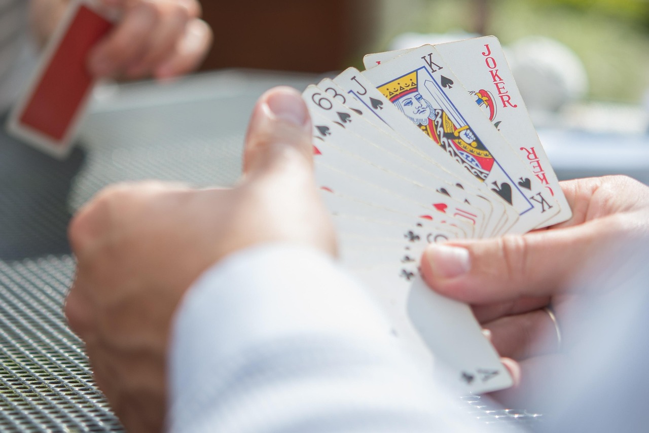holding playing cards holding playing cards